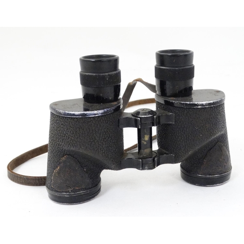 530 - A mid 20thC pair of Bausch & Lomb 6 x 30 binoculars , in a fitted leather case