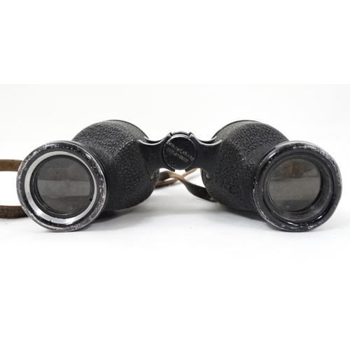 530 - A mid 20thC pair of Bausch & Lomb 6 x 30 binoculars , in a fitted leather case