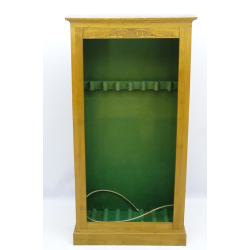 558 - Shooting: A gun display cabinet, of oak construction with visible dovetail joints, floral and scroll... 