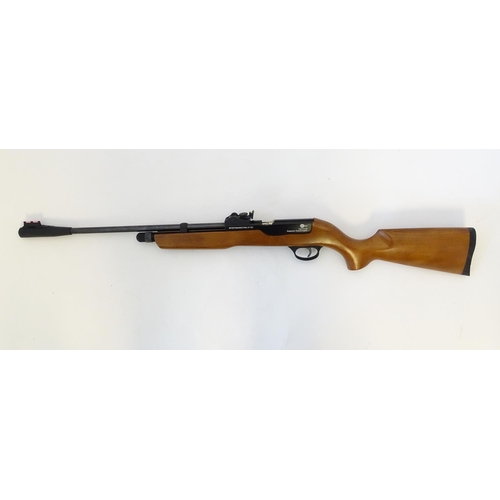 579 - Airgun: An 'XT501 Rabbit Destroyer' .22/5.5mm CO2 bolt-action air rifle by SMK, England.  21 3/4'' b... 