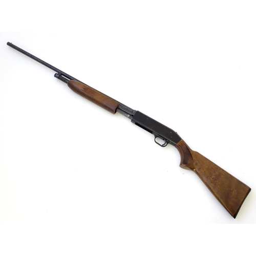 597 - Shotgun: A '500E' .410 pump-action shotgun by Mossberg, USA. 26'' ribless fixed choke barrel with 3'... 