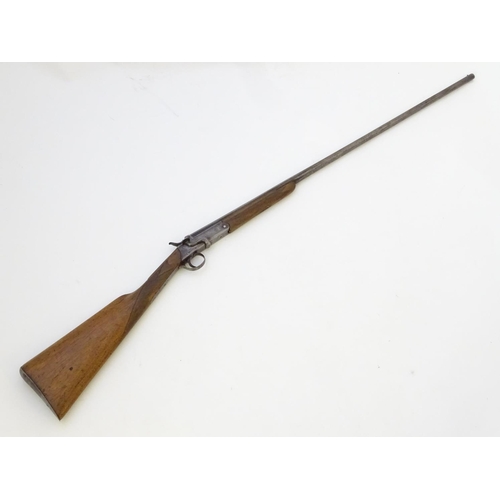 600 - Shotgun: A .410 single barrel sidelever hammergun, of Belgian origin.  29 1/2'' half-octagonal fixed... 