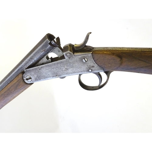 600 - Shotgun: A .410 single barrel sidelever hammergun, of Belgian origin.  29 1/2'' half-octagonal fixed... 