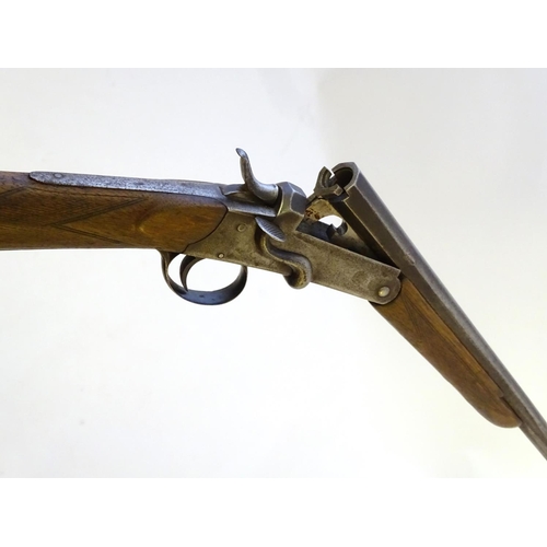 600 - Shotgun: A .410 single barrel sidelever hammergun, of Belgian origin.  29 1/2'' half-octagonal fixed... 