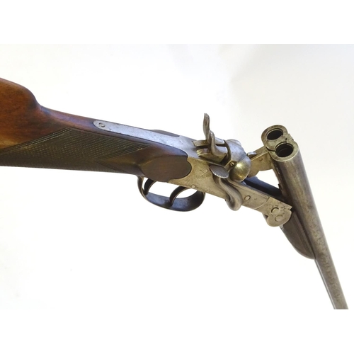 602 - Shotgun: A .410 folding side by side sidelever hammergun, of Belgian origin.  27 1/2'' fixed choke b... 