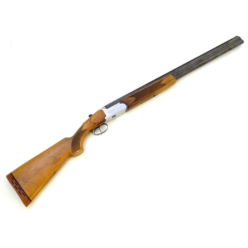 606 - Shotgun: A 12 bore over and under boxlock shotgun by FIAS, Italy for Gower Ltd. 28'' fixed choke bar... 