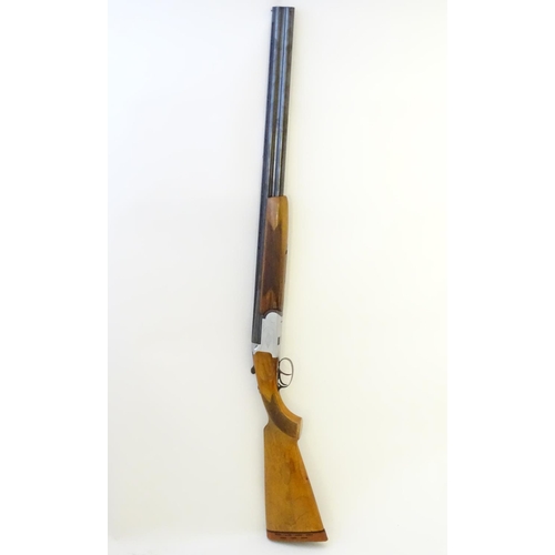 606 - Shotgun: A 12 bore over and under boxlock shotgun by FIAS, Italy for Gower Ltd. 28'' fixed choke bar... 