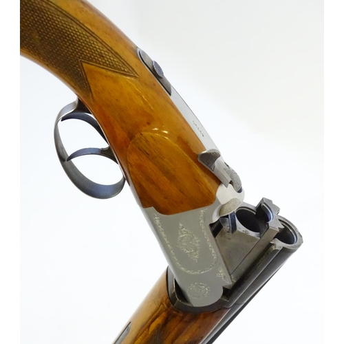 606 - Shotgun: A 12 bore over and under boxlock shotgun by FIAS, Italy for Gower Ltd. 28'' fixed choke bar... 