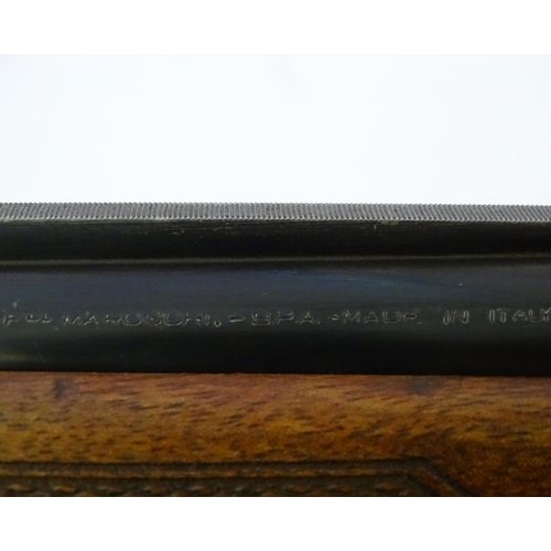 607 - Shotgun: A 12 bore over and under boxlock ejector shotgun by Marocchi, Italy.  28'' barrels with ext... 