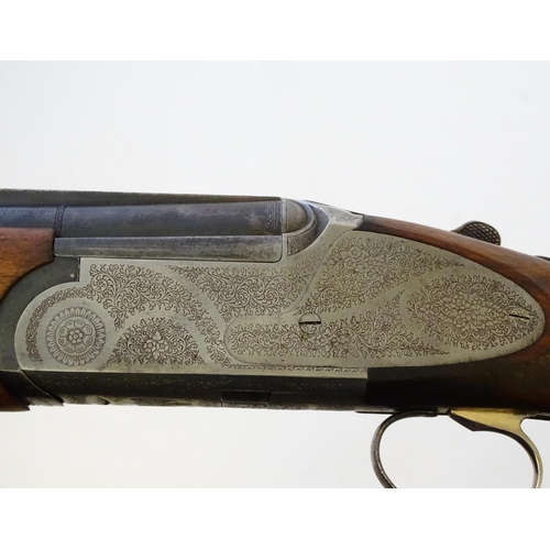 609 - Shotgun: A 12 bore over and under sideplate boxlock ejector shotgun by Emilio Rizzini, Italy. 27 1/4... 