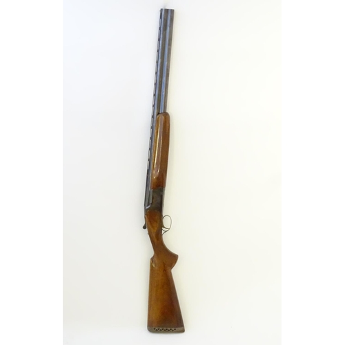 610 - Shotgun: An 'MK60' 12 bore over and under boxlock ejector shotgun by Miroku, Japan. 26'' fixed choke... 