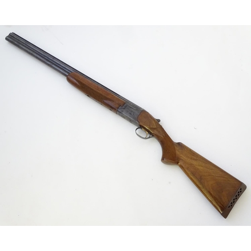 610 - Shotgun: An 'MK60' 12 bore over and under boxlock ejector shotgun by Miroku, Japan. 26'' fixed choke... 