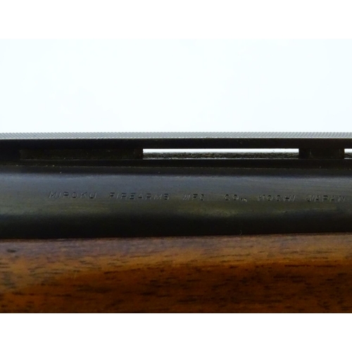 610 - Shotgun: An 'MK60' 12 bore over and under boxlock ejector shotgun by Miroku, Japan. 26'' fixed choke... 