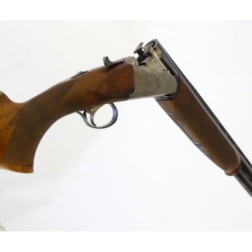 611 - Shotgun: A 'Gold' 12 bore over and under boxlock ejector shotgun by Gamba, Italy. 30'' fixed choke b... 