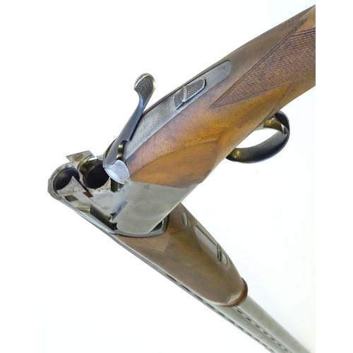 611 - Shotgun: A 'Gold' 12 bore over and under boxlock ejector shotgun by Gamba, Italy. 30'' fixed choke b... 