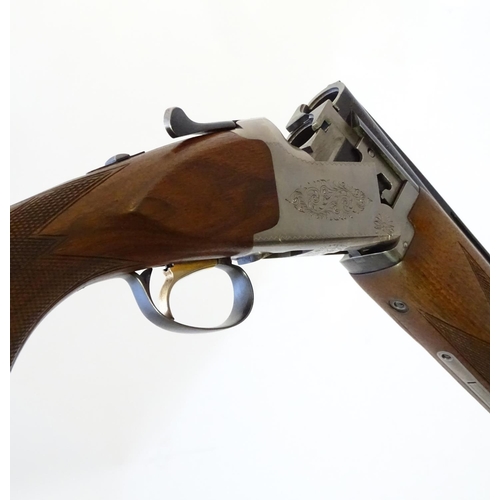 612 - Shotgun: A '6000' 12 bore over and under boxlock ejector shotgun by Miroku, Japan.  28'' fixed choke... 