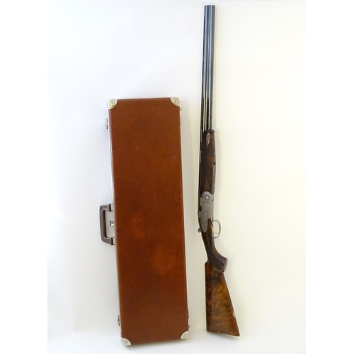 614 - Shotgun: A cased 'S687 EELL Diamond Pigeon' 20 bore over and under sidelock ejector shotgun by P Ber... 