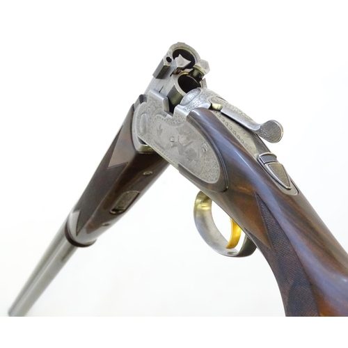 614 - Shotgun: A cased 'S687 EELL Diamond Pigeon' 20 bore over and under sidelock ejector shotgun by P Ber... 