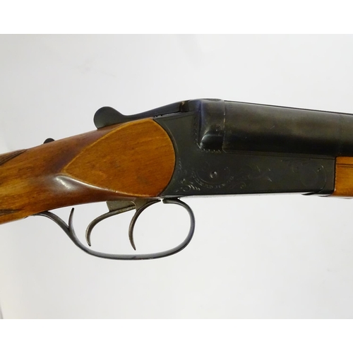 623 - Shotgun: A 16 bore side by side boxlock shotgun by Baikal, USSR.  28 3/4'' fixed choke barrels with ... 