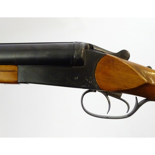 623 - Shotgun: A 16 bore side by side boxlock shotgun by Baikal, USSR.  28 3/4'' fixed choke barrels with ... 