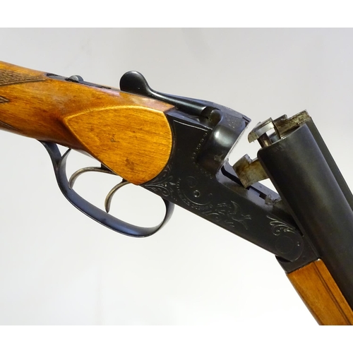 623 - Shotgun: A 16 bore side by side boxlock shotgun by Baikal, USSR.  28 3/4'' fixed choke barrels with ... 