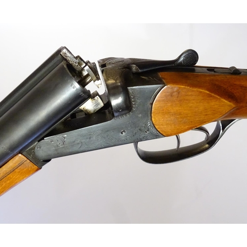 623 - Shotgun: A 16 bore side by side boxlock shotgun by Baikal, USSR.  28 3/4'' fixed choke barrels with ... 