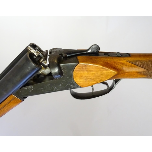 623 - Shotgun: A 16 bore side by side boxlock shotgun by Baikal, USSR.  28 3/4'' fixed choke barrels with ... 