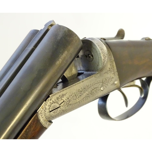 627 - Shotguns: A composed-matched pair of 'Avant Tout' 12 bore side by side boxlock ejector shotguns by C... 