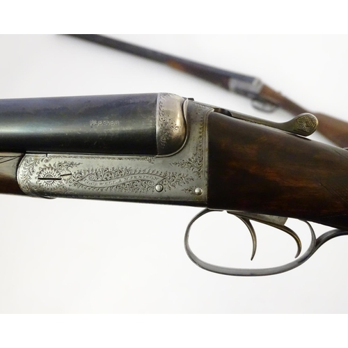 627 - Shotguns: A composed-matched pair of 'Avant Tout' 12 bore side by side boxlock ejector shotguns by C... 