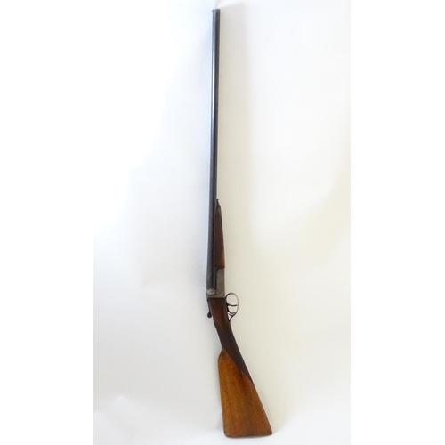 630 - Shotgun: A 20 bore side by side boxlock shotgun, of Belgian origin. 27 3/4'' fixed choke barrels wit... 