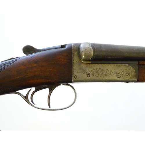 630 - Shotgun: A 20 bore side by side boxlock shotgun, of Belgian origin. 27 3/4'' fixed choke barrels wit... 