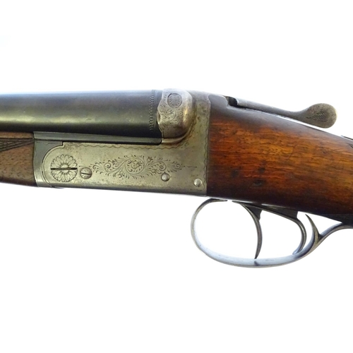 630 - Shotgun: A 20 bore side by side boxlock shotgun, of Belgian origin. 27 3/4'' fixed choke barrels wit... 