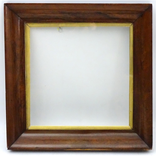 180 - A 19 thC Rosewood wide moulded frame with gilt slip and glass. Internal measurement 20 3/4'' square ... 