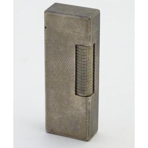 A 1971-model silver plated Dunhill 'Rollagas' lighter, the body with 'barley' cheq