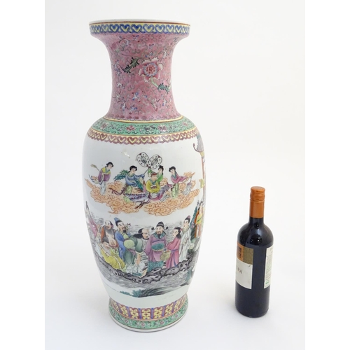 1 - A large 20thC Chinese famille rose vase decorated with imperial figures and elders surrounded by peo... 