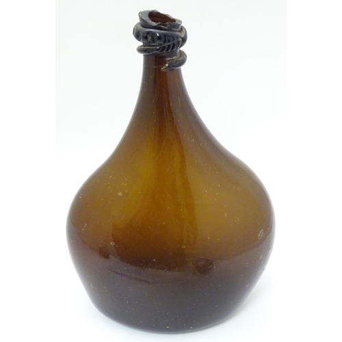 100 - An 18thC Georgian brown glass large bottle with applied top and kick-up under, 12 1/2'' high.