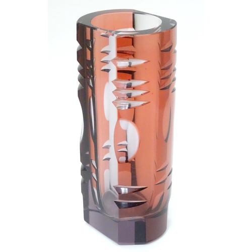 106 - Murano : a 1960's purple glass vase with cut decoration and slice cut sides, 8'' high.