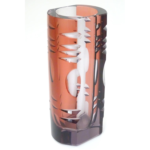 106 - Murano : a 1960's purple glass vase with cut decoration and slice cut sides, 8'' high.