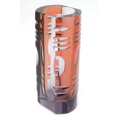 106 - Murano : a 1960's purple glass vase with cut decoration and slice cut sides, 8'' high.