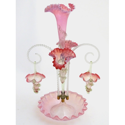 121 - Victorian Vaseline Cranberry Glass Epergne/centrepiece: a flared wavy rim base with two clear barley... 