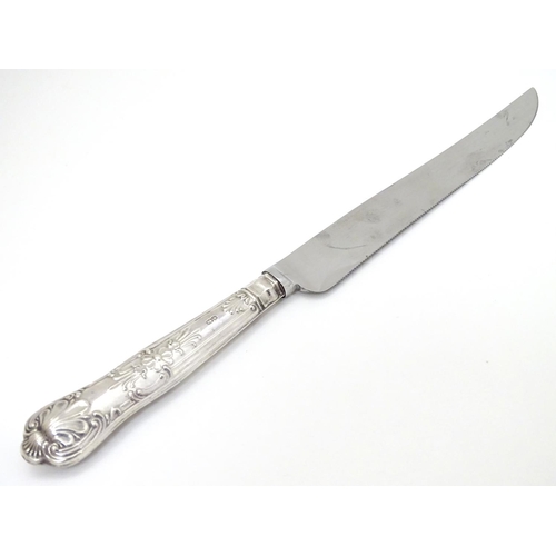 127 - A silver handled cake knife 10 1/2'' long