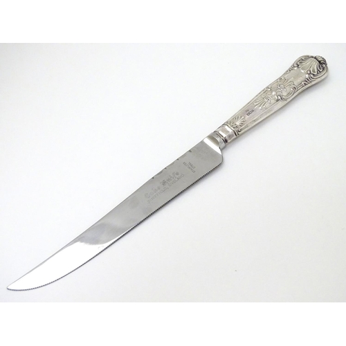 127 - A silver handled cake knife 10 1/2'' long