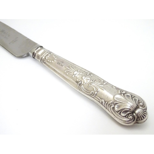 127 - A silver handled cake knife 10 1/2'' long