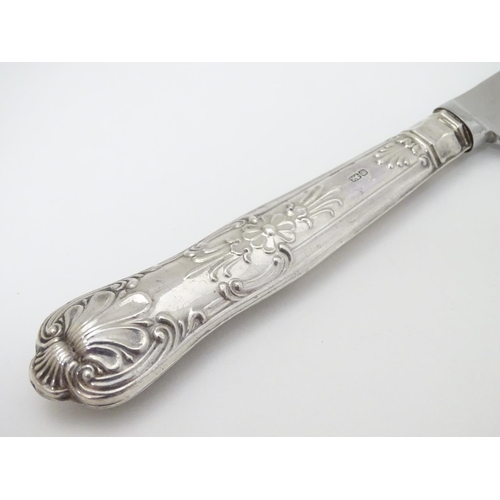 127 - A silver handled cake knife 10 1/2'' long