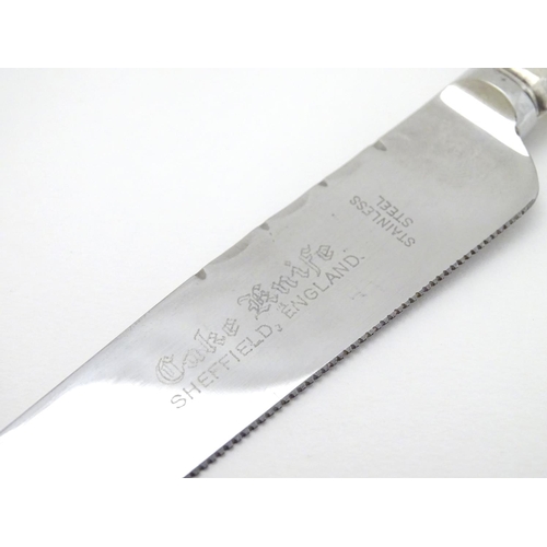 127 - A silver handled cake knife 10 1/2'' long