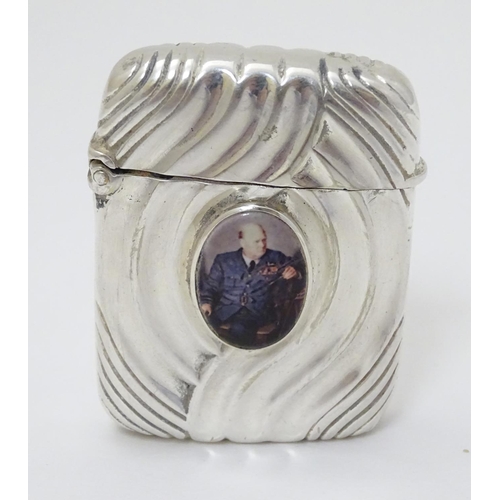 128 - A silver vesta case converted to a lighter and with later applied cabochon depicting Winston Churchi... 