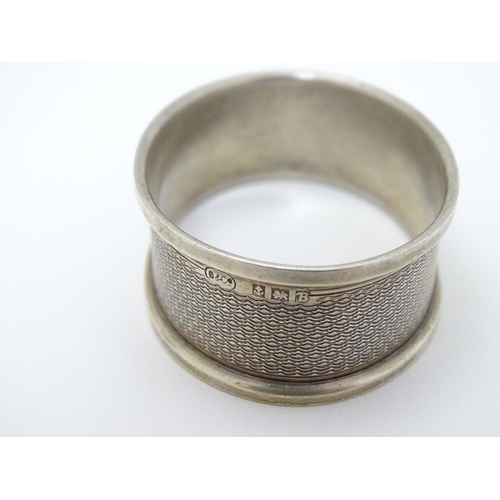 129 - A silver napkin ring Birmingham 1951 maker B & Co. Together with a thimble hallmarked Birmingham 192... 