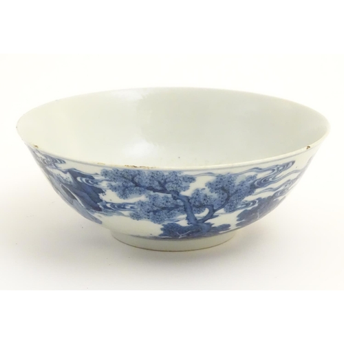 13 - A 19thC Chinese blue and white bowl depicting figures in a landscape. Approx. 2 3/4'' high x 7 1/2''... 