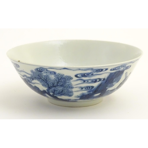 13 - A 19thC Chinese blue and white bowl depicting figures in a landscape. Approx. 2 3/4'' high x 7 1/2''... 