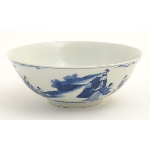 13 - A 19thC Chinese blue and white bowl depicting figures in a landscape. Approx. 2 3/4'' high x 7 1/2''... 